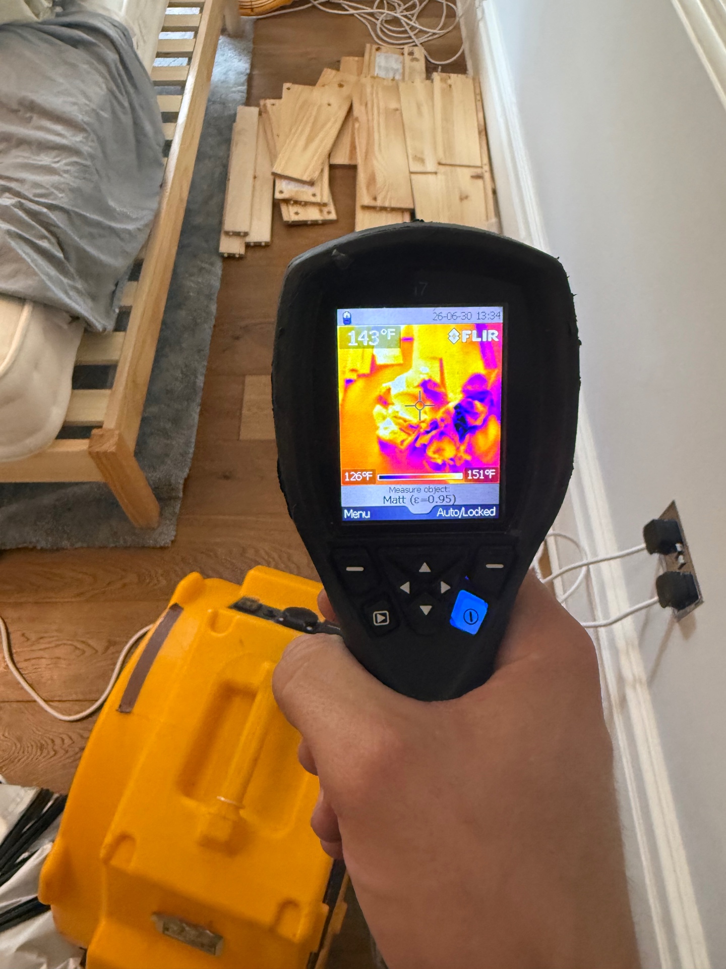 FLIR thermal reading 143°F on bedroom floor mid-treatment