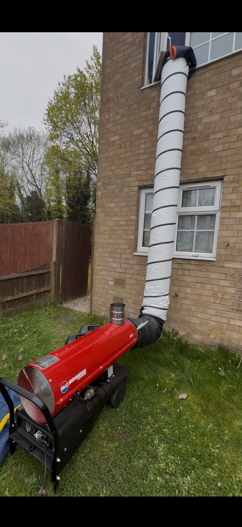 Biemmedue heater ducted into a first-floor window