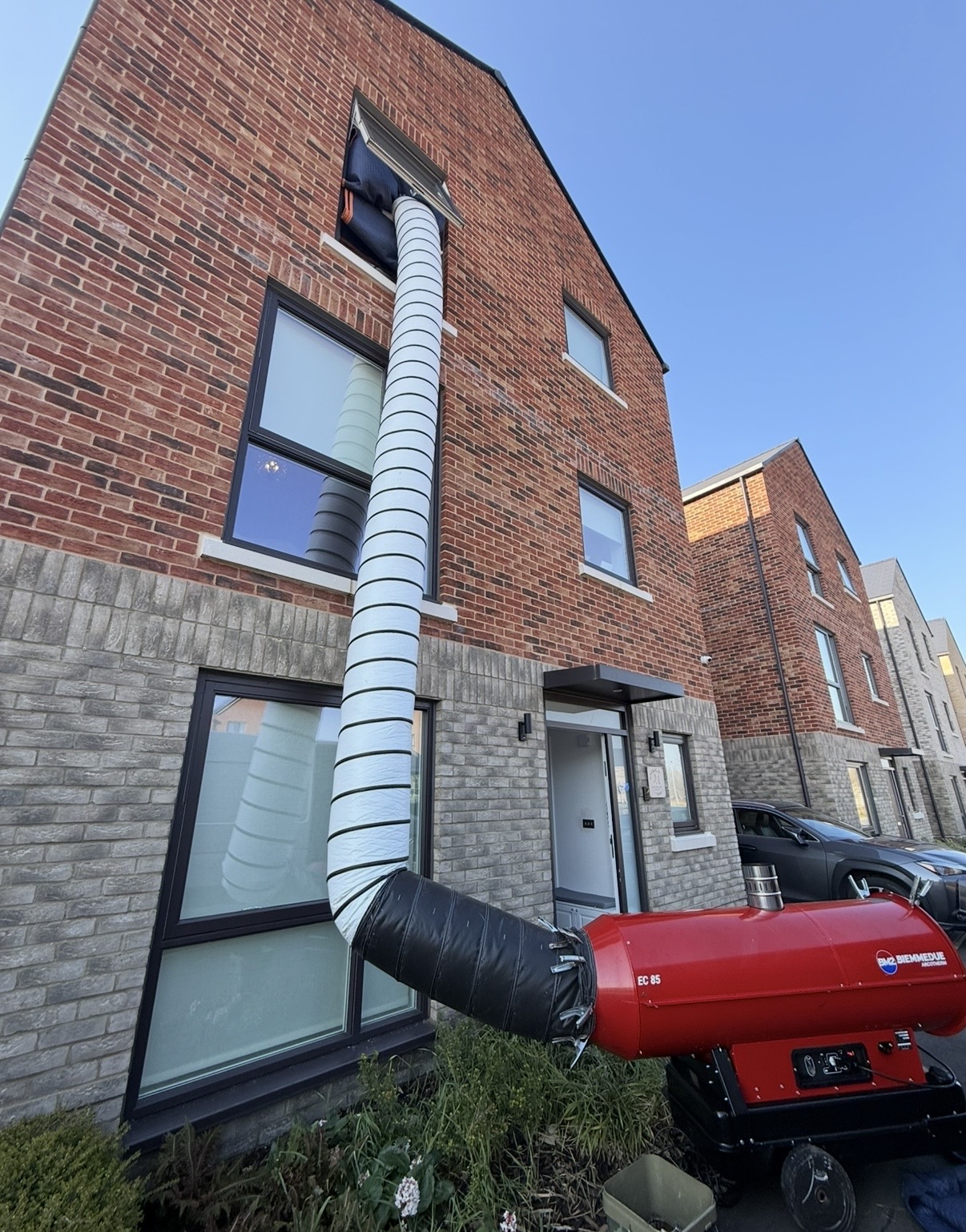 EC85 heater treating a three-storey new build