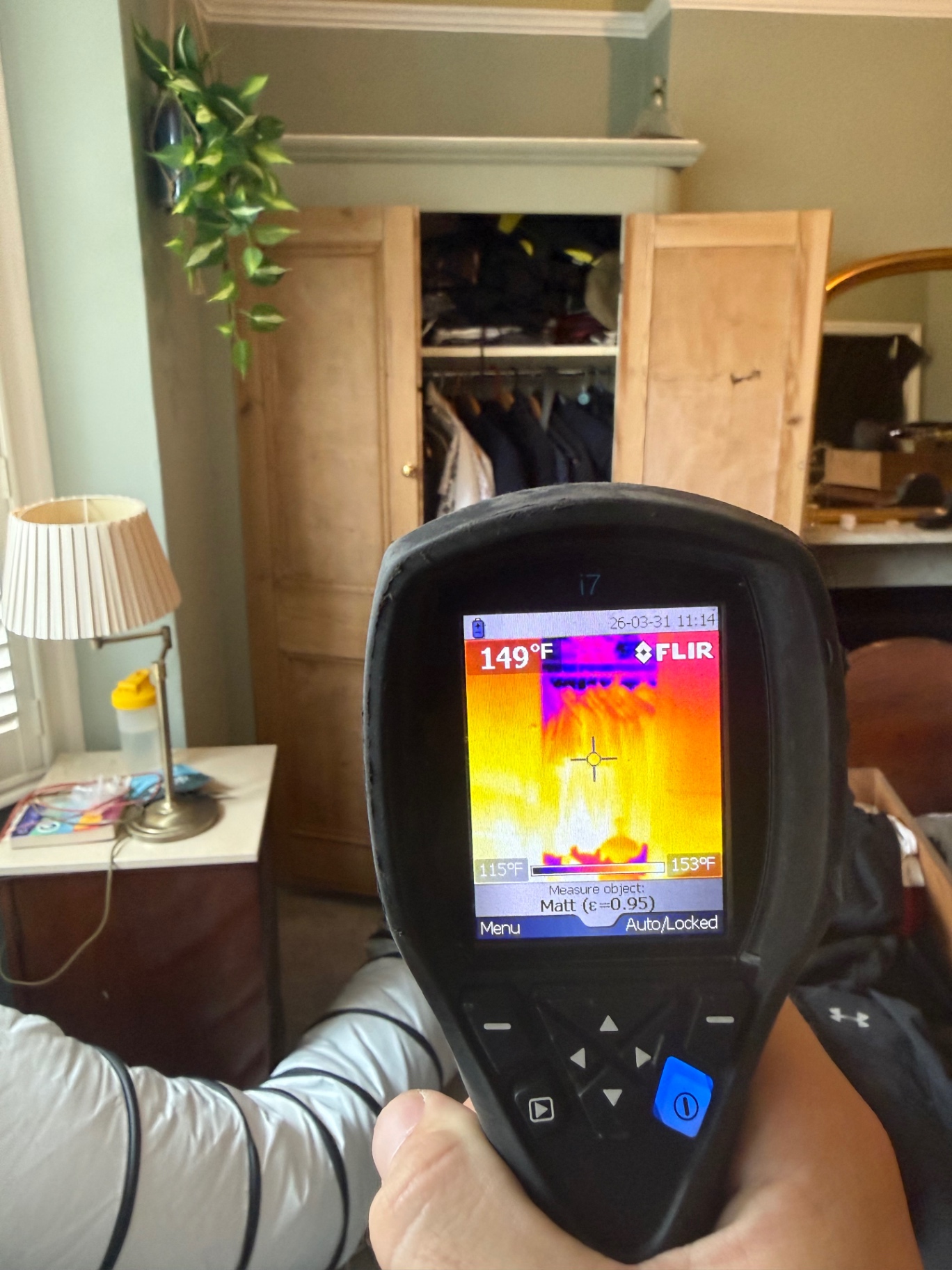 FLIR thermal reading 149°F by a wardrobe
