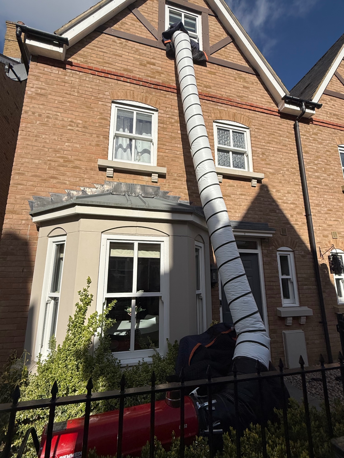 Heat treatment ducting running up a three-storey house