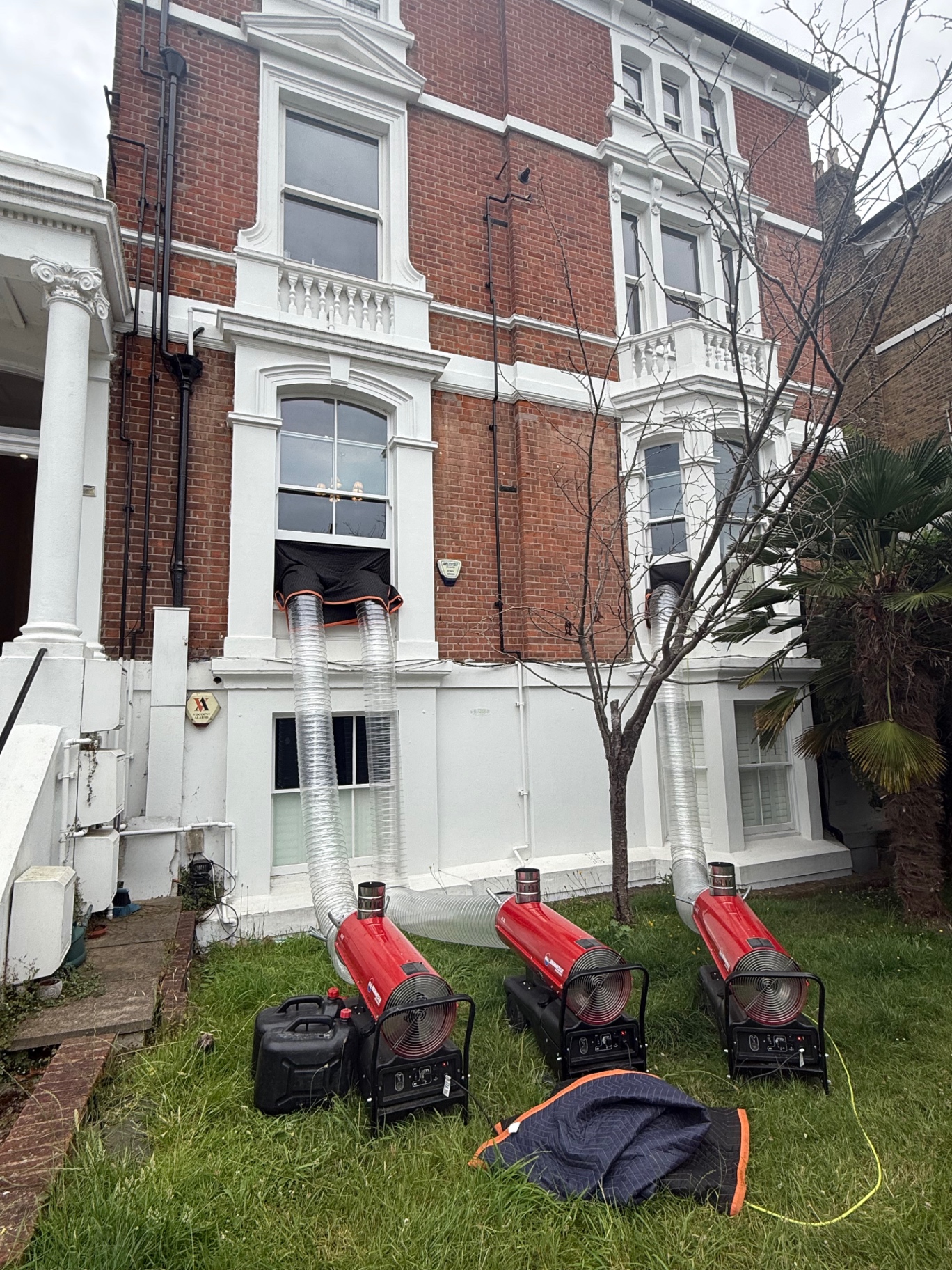 Three industrial heaters ducting into a London townhouse