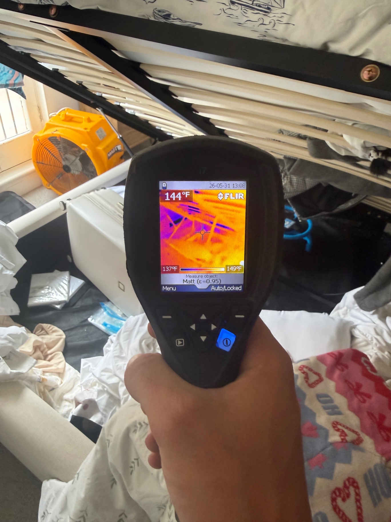 FLIR thermal reading 144°F under a bed frame