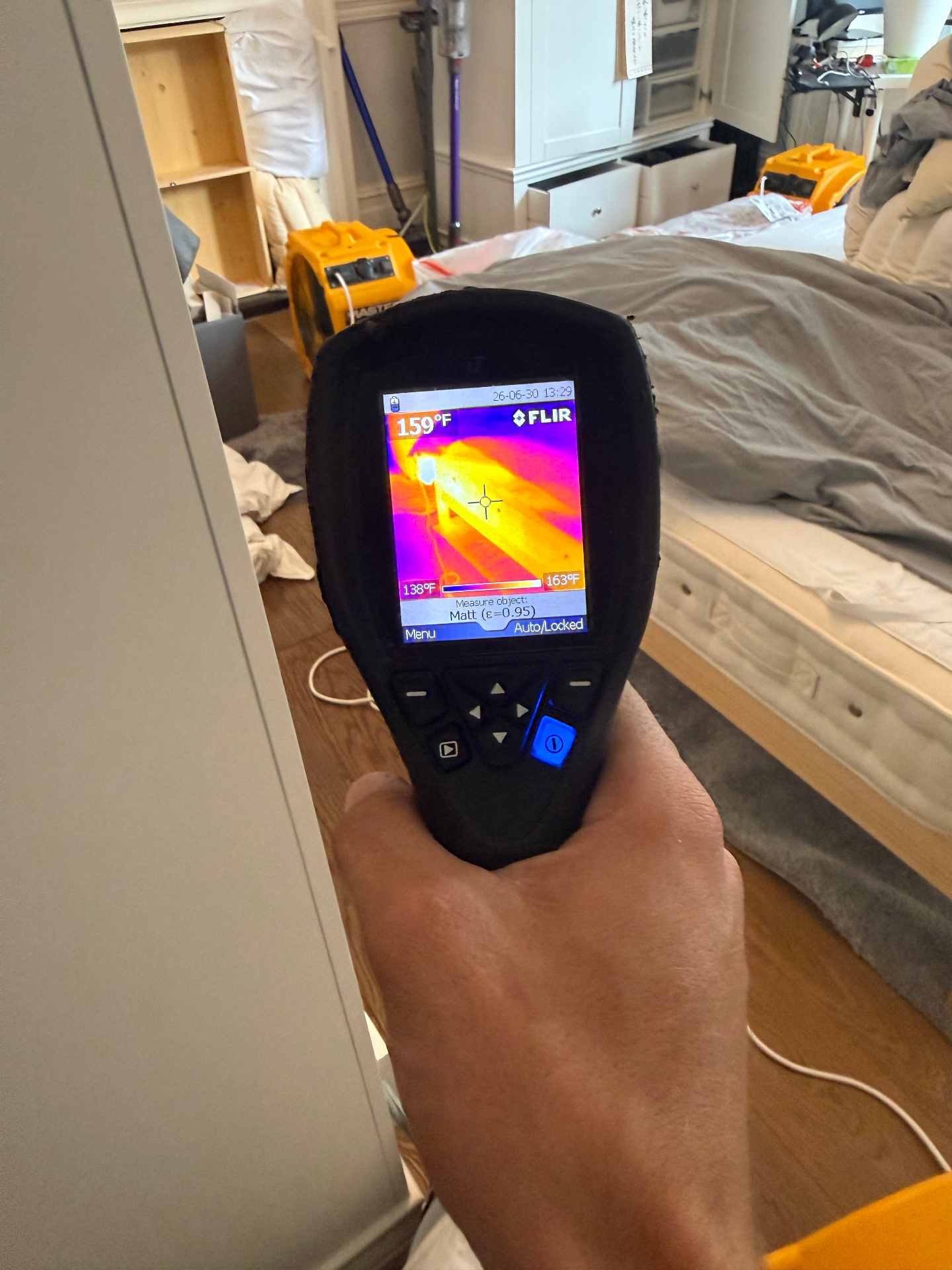 FLIR thermal reading 159°F on bed frame during bedbug heat treatment