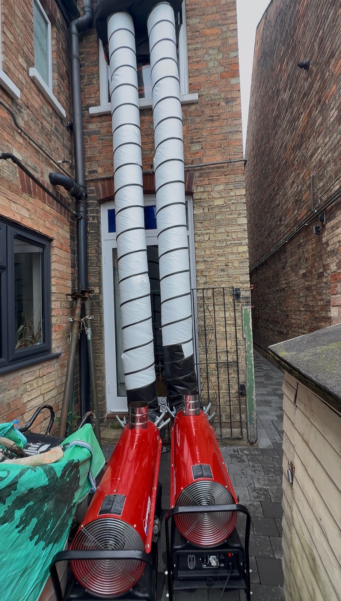 Twin Acrotherm heaters ducting into a town house
